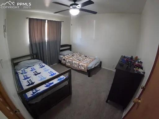 Image 13 of 22: Bedroom with a ceiling fan and carpet flooring