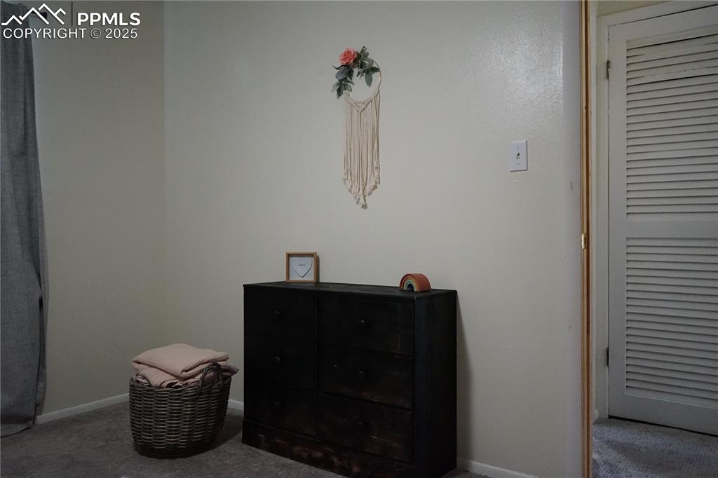 Image 16 of 22: Carpeted bedroom featuring baseboards
