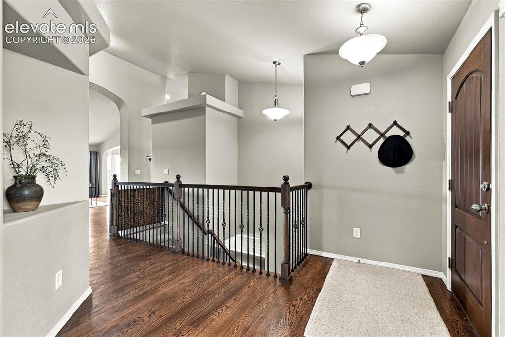 Image 10 of 49: Open main-level layout with architectural details and abundant natural ligh