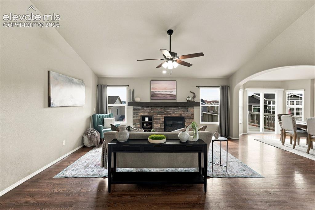 Image 11 of 49: Open-concept living area flows seamlessly into the kitchen and dining space