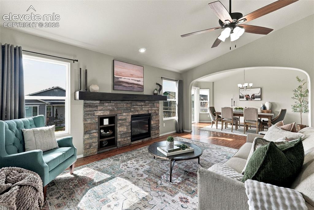 Image 12 of 49: Spacious family room with fireplace and an easy connection to the kitchen.