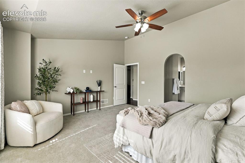Image 26 of 49: Generously sized primary bedroom filled with natural light.