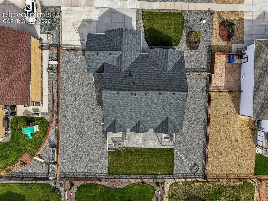 Image 45 of 49: Aerial perspective showcases the home’s lot, driveway and outdoor spaces.