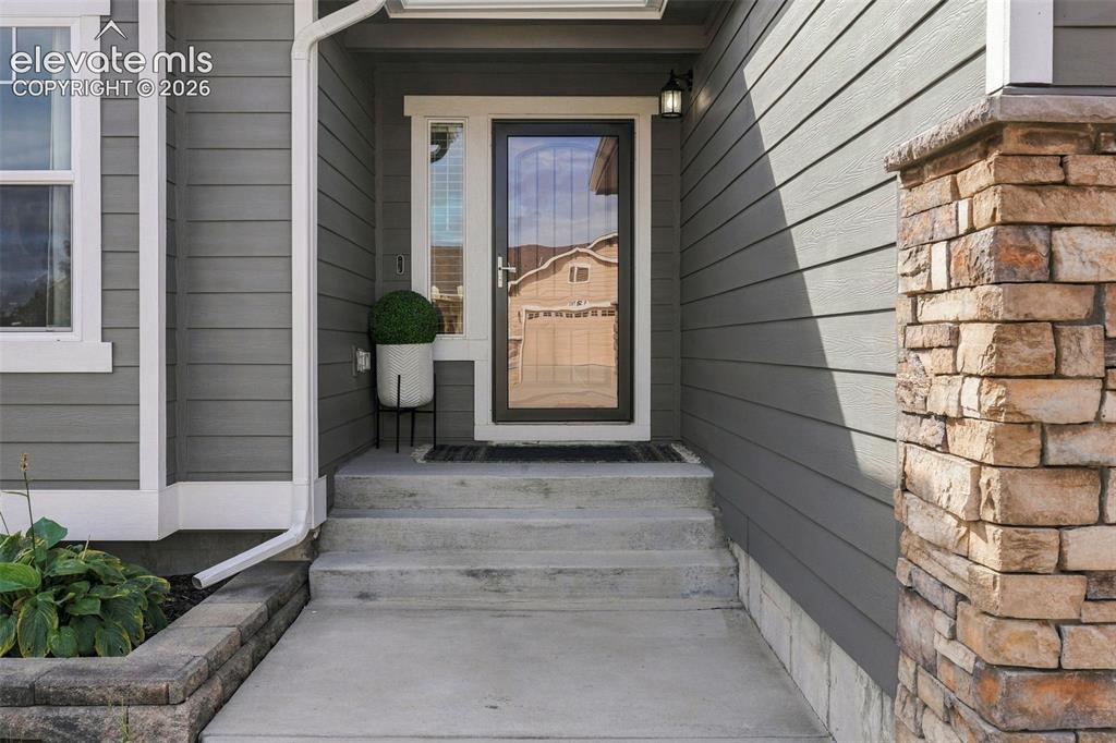 Image 5 of 49: Covered front entry creates a welcoming first impression.