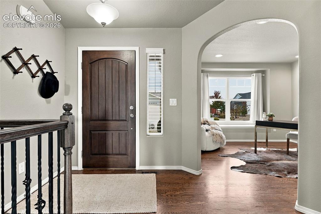Image 7 of 49: Bright entryway with open sightlines into the main level.
