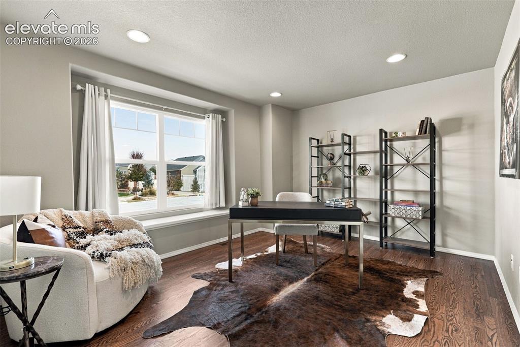 Image 8 of 49: Spacious Home Office filled with natural light.