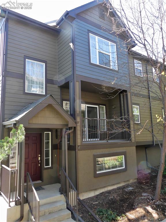 Image 2 of 33: View of front of house with a balcony