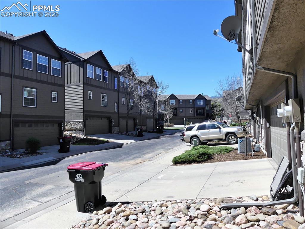 Image 30 of 33: View of road with sidewalks and a residential view