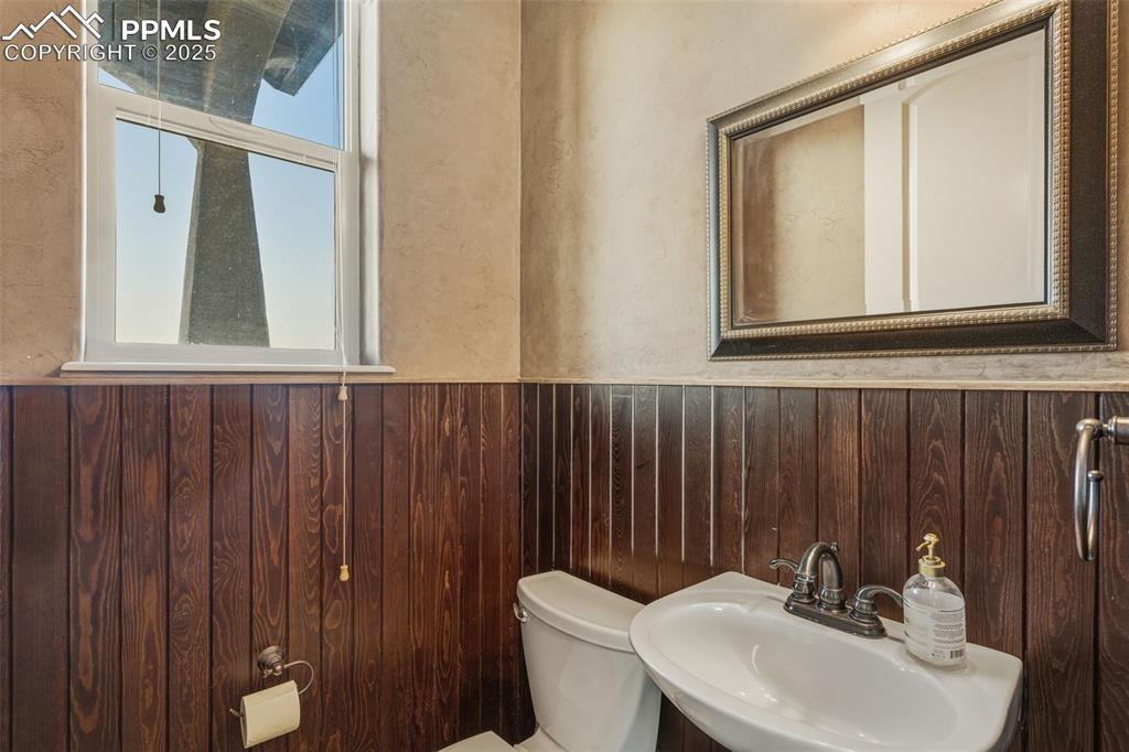 Image 19 of 49: Bathroom with a sink and wainscoting