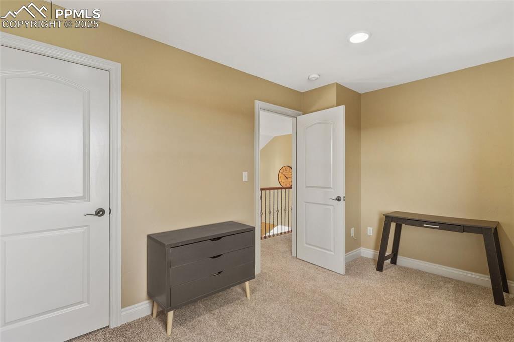 Image 29 of 49: Bedroom featuring light carpet and baseboards