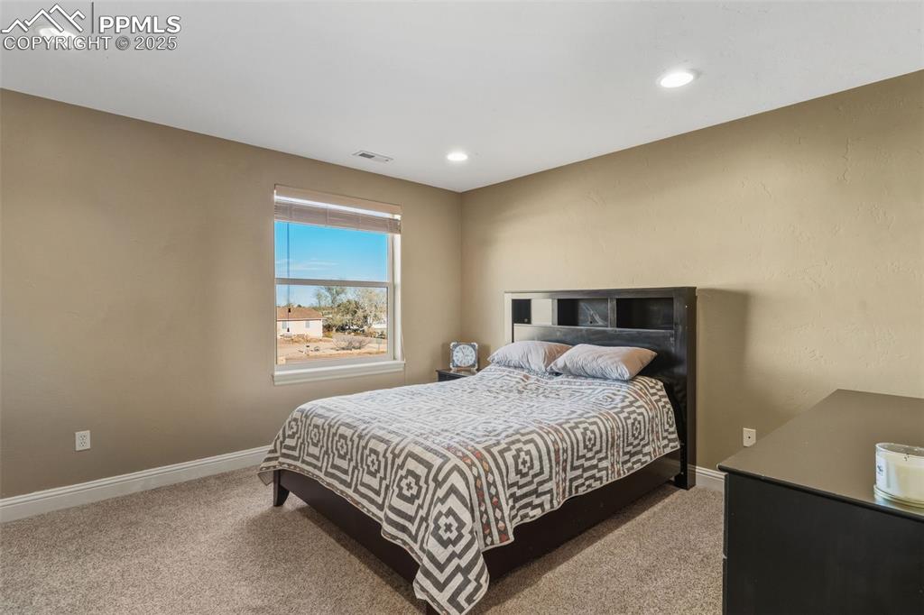 Image 31 of 49: Carpeted bedroom featuring baseboards and recessed lighting