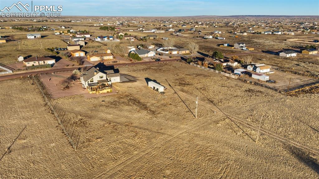 Image 47 of 49: View of rural area featuring nearby suburban area