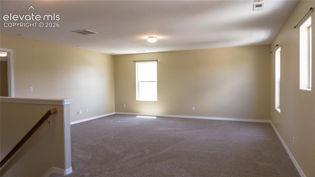 Image 12 of 32: Upper level loft family room