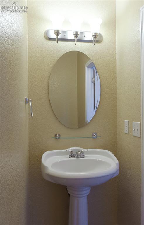 Image 27 of 32: Main level powder room