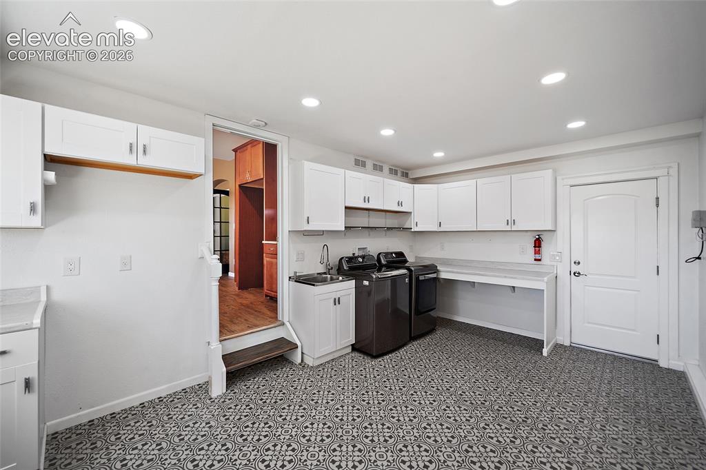 Image 23 of 50: Tandem Garage was converted to a utility/laundry room