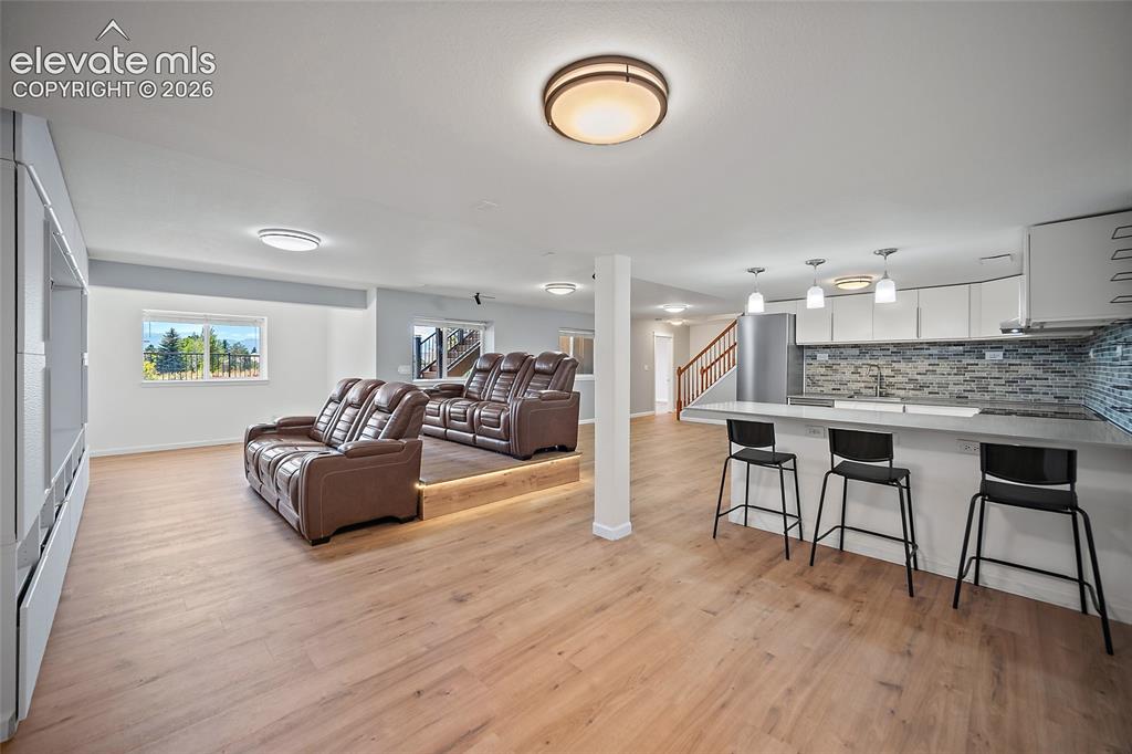 Image 36 of 50: Full home theatre with heated movie seats, built in cabinets