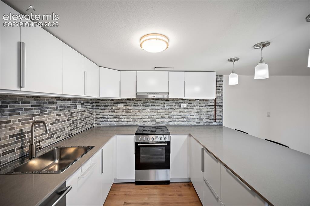 Image 37 of 50: Modern Kitchenette with all appliances, soft close cabinets & Lazy Susan.