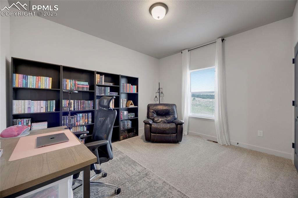 Image 16 of 37: Office featuring light carpet and baseboards