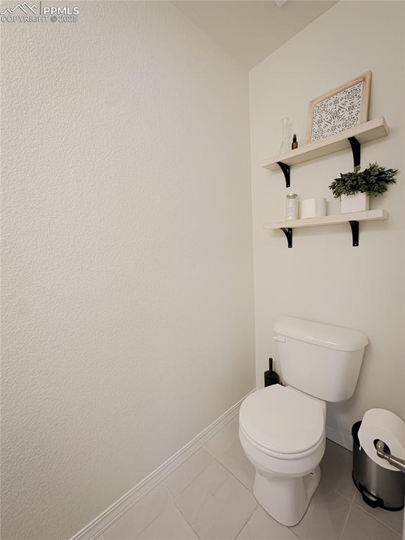 Image 11 of 42: Bathroom featuring light tile patterned floors