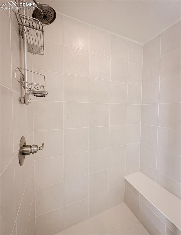 Image 30 of 42: Bathroom featuring a tile shower