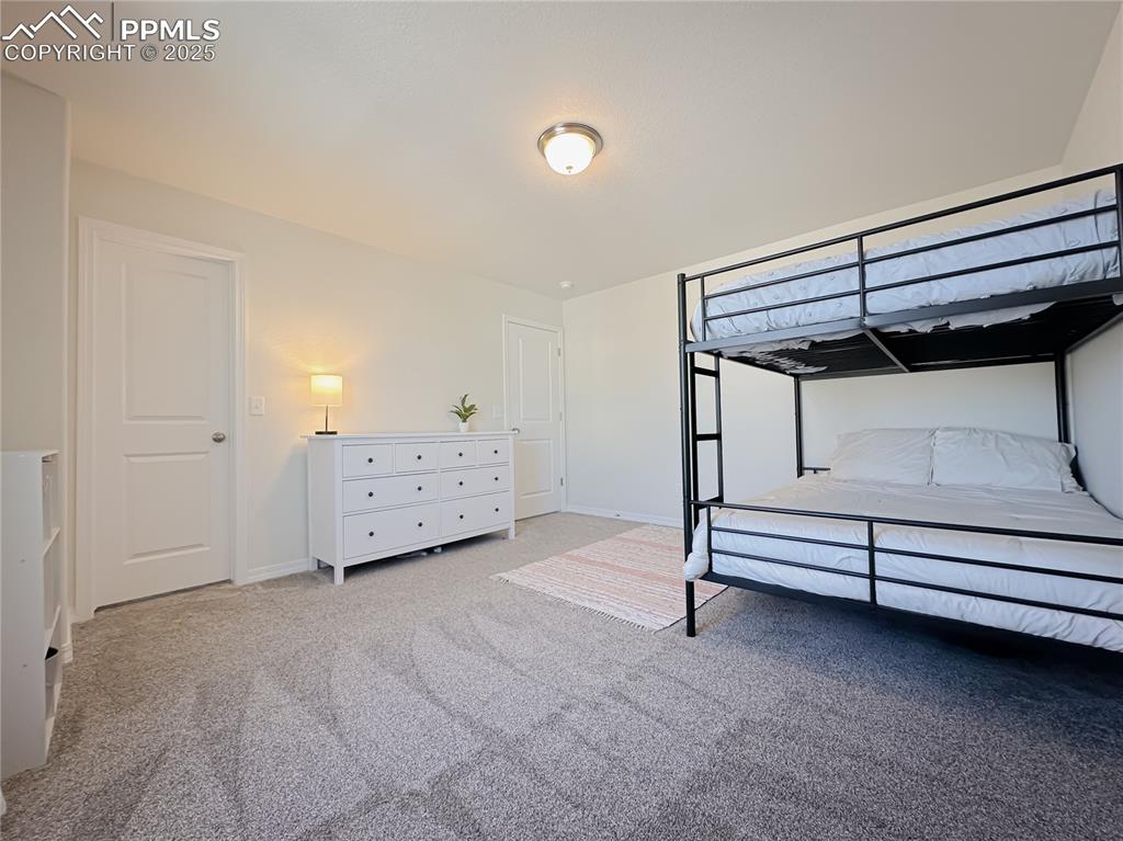 Image 36 of 42: Bedroom with carpet and baseboards