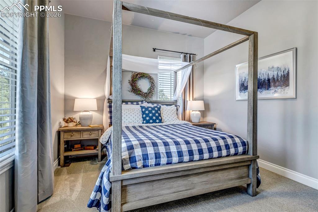 Image 16 of 50: Dining area featuring suspended lighting, french doors, dark wood-type floo