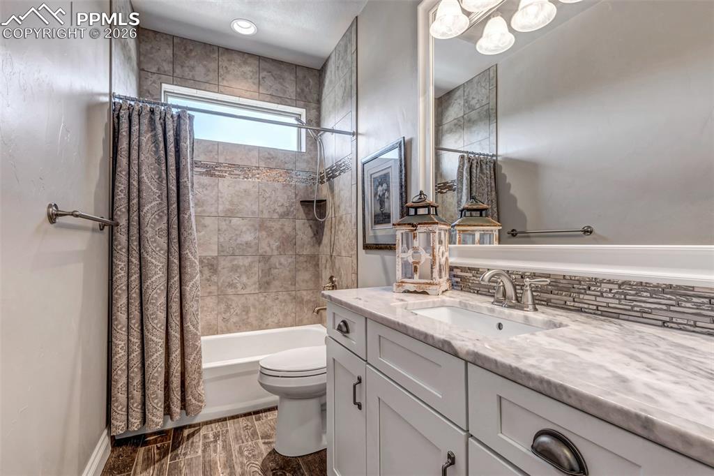 Image 18 of 50: Bedroom featuring light carpet and baseboards