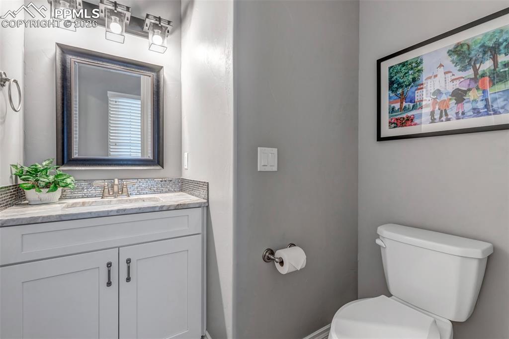 Image 19 of 50: Bedroom featuring light carpet and baseboards