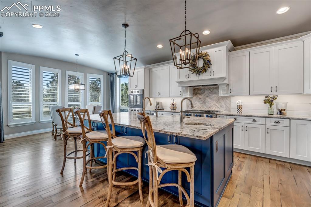 Image 21 of 50: Full bathroom with vanity, shower / tub combo with curtain, and dark wood-s