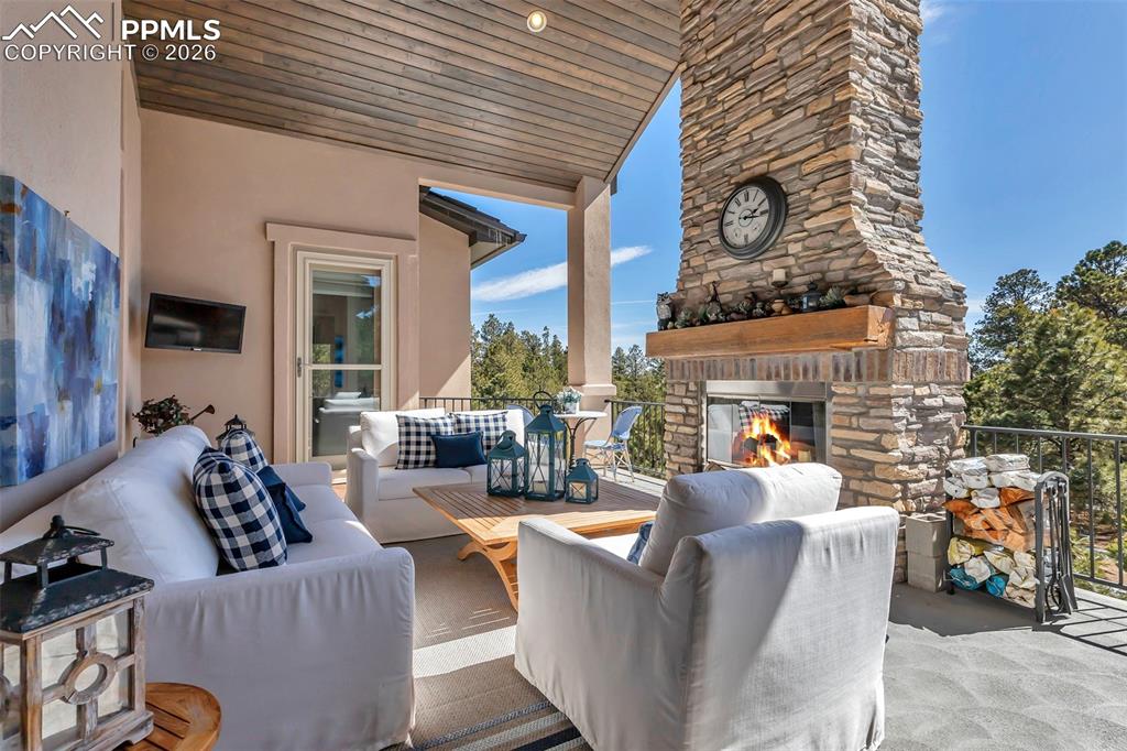 Image 29 of 50: Dining room with hanging lights and light wood-style floors