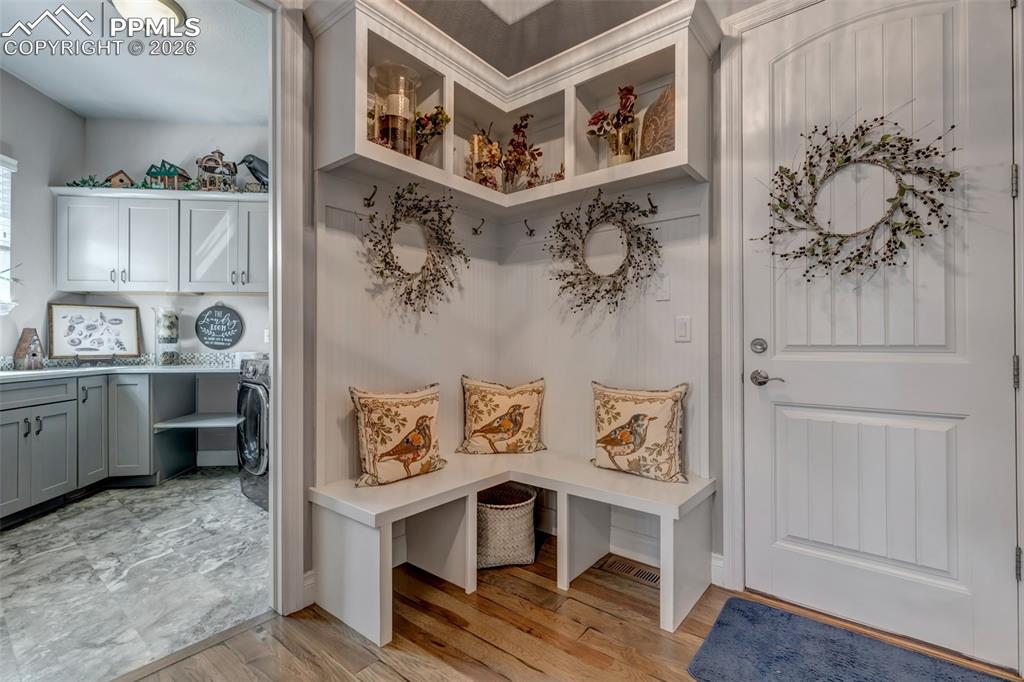 Image 31 of 50: Dining room featuring light wood-style flooring and hanging lights