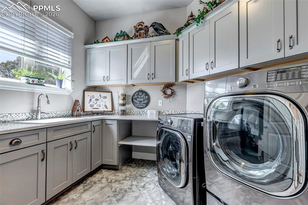 Image 32 of 50: View of patio / terrace with an outdoor living space with a fireplace