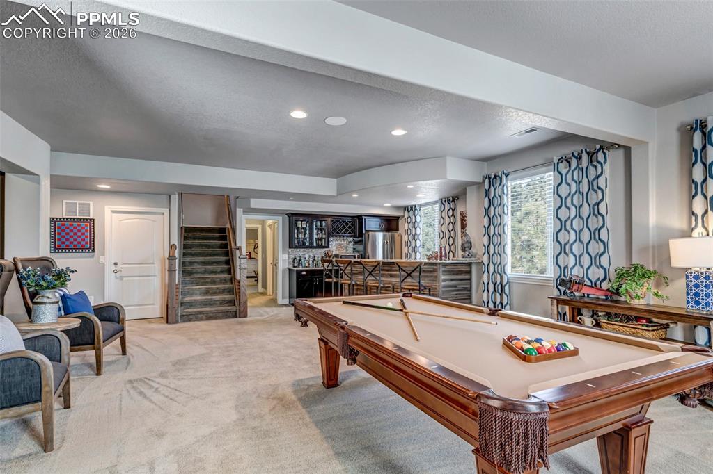 Image 34 of 50: Mudroom with light wood-style floors and washer / clothes dryer