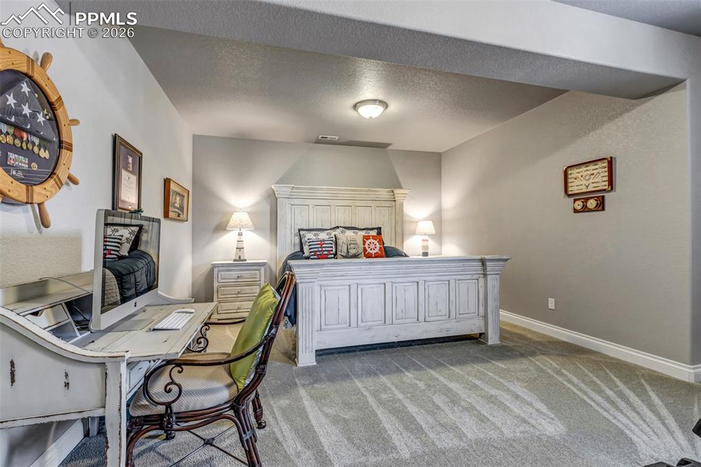 Image 37 of 50: Game room with light colored carpet, bar area, recessed lighting, billiards