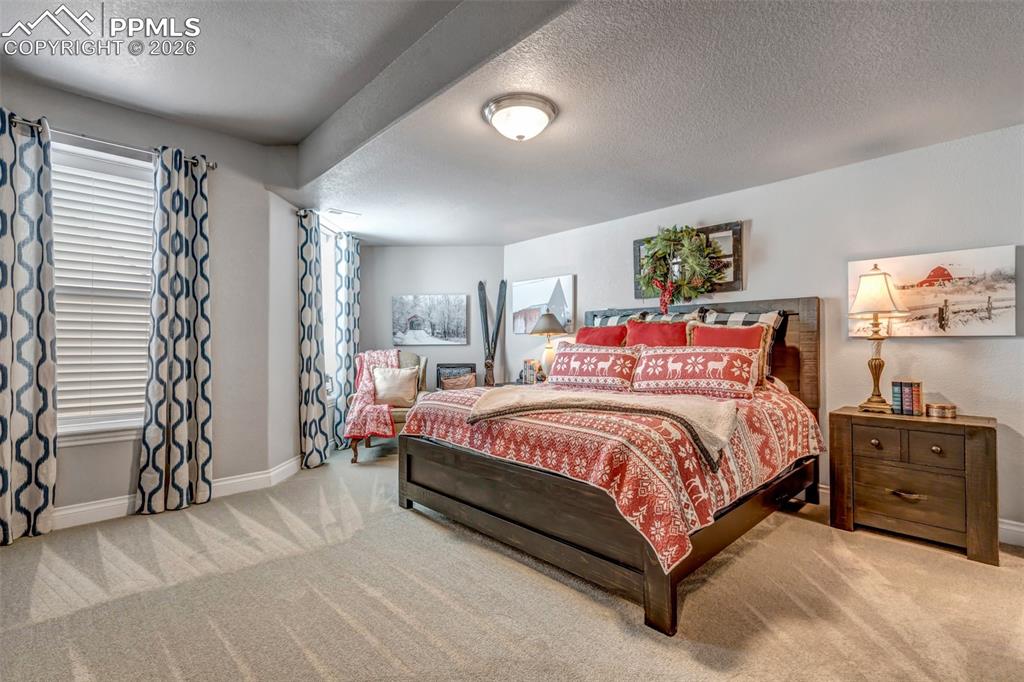 Image 38 of 50: Playroom with pool table, light colored carpet, a textured ceiling, and rec