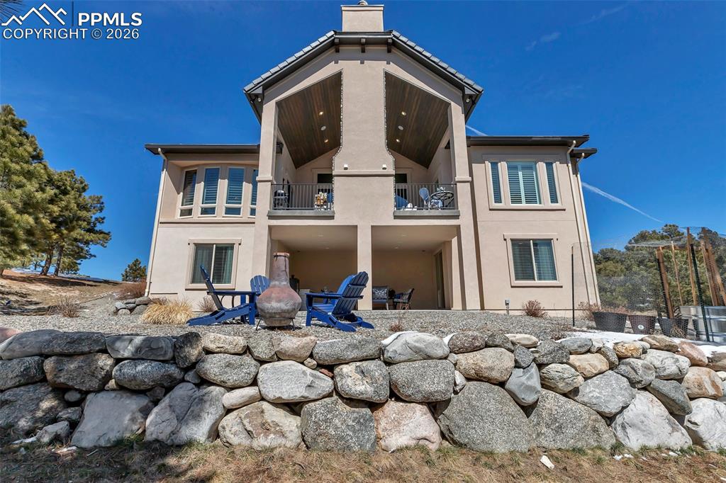 Image 46 of 50: Bathroom featuring vanity, shower / tub combo with curtain, and a textured 