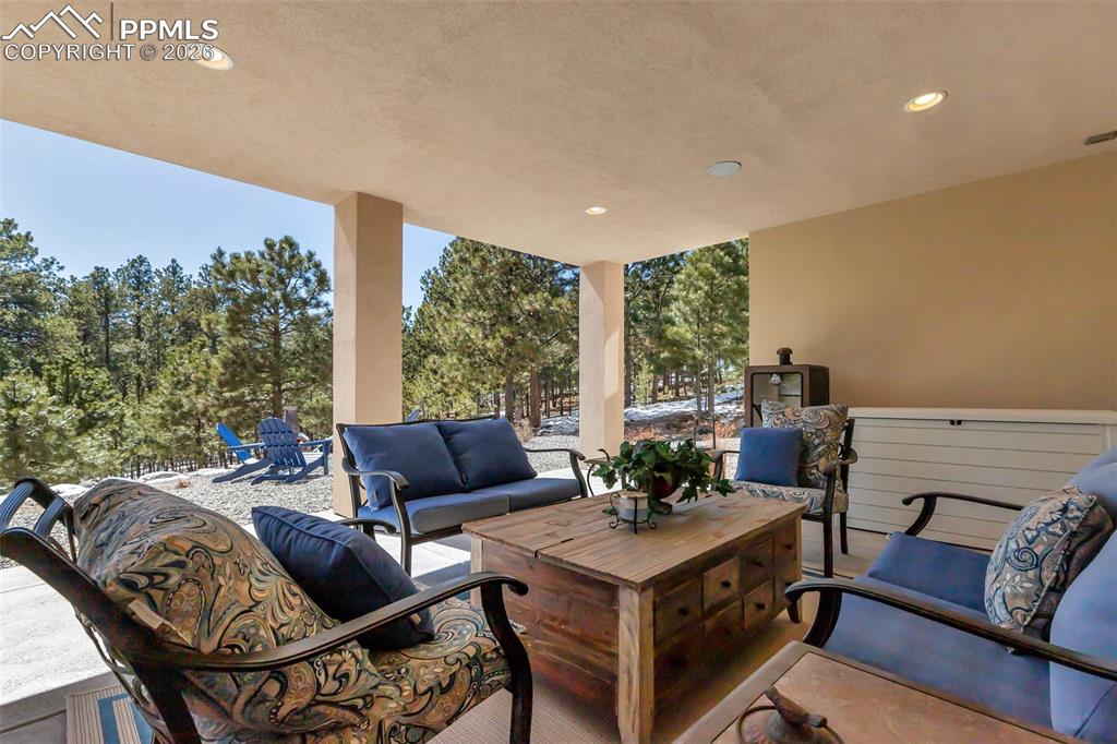 Image 48 of 50: Bedroom with light carpet and a textured ceiling