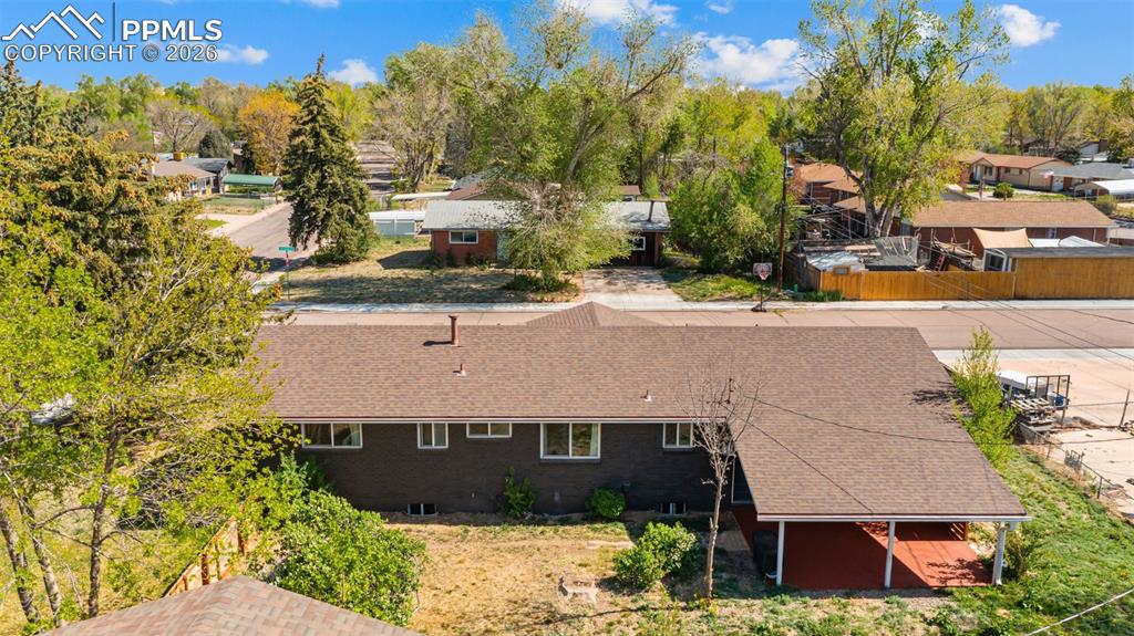 Image 35 of 42: Aerial perspective showcasing a single-story dwelling with a brown shingle 