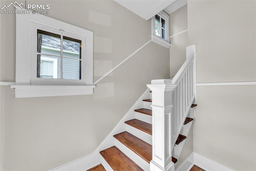 Image 16 of 49: Staircase featuring plenty of natural light