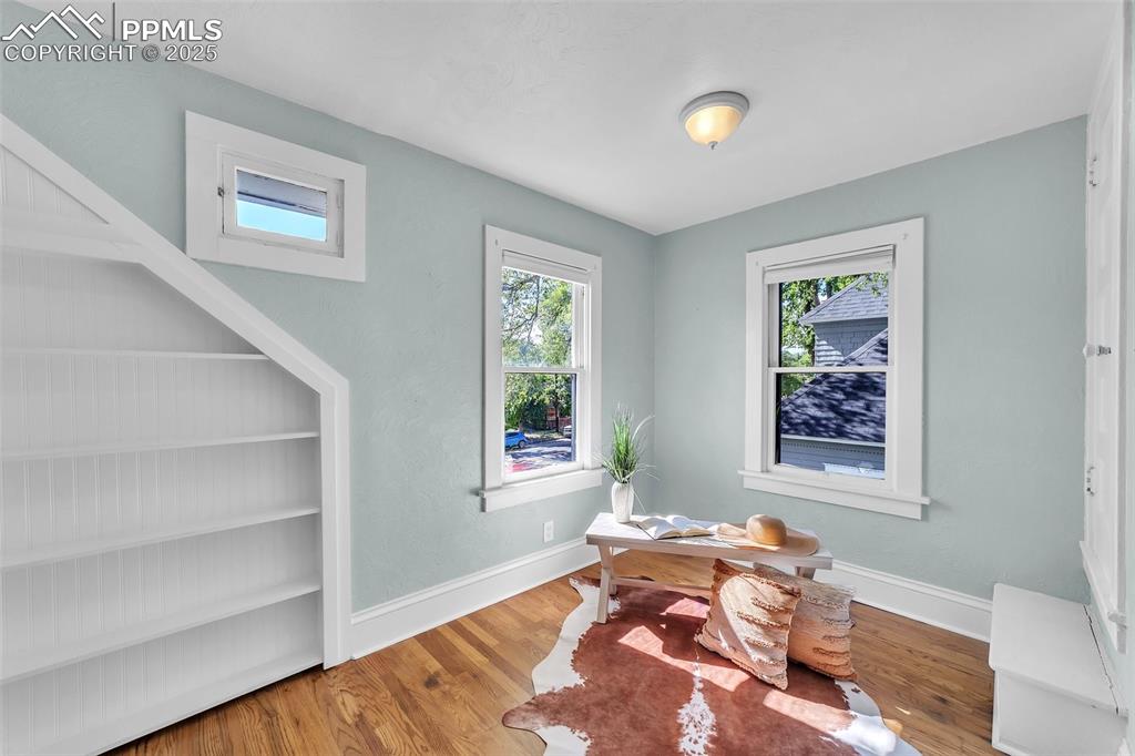 Image 17 of 49: Office space or bedroom featuring wood finished floors