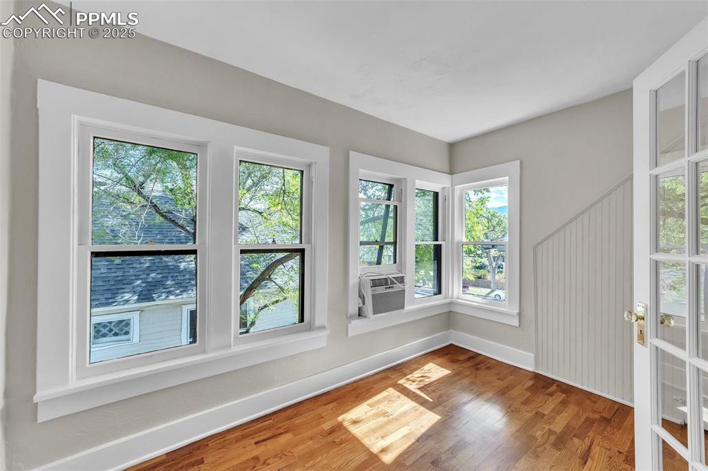 Image 20 of 49: Unfurnished sunroom with cooling unit