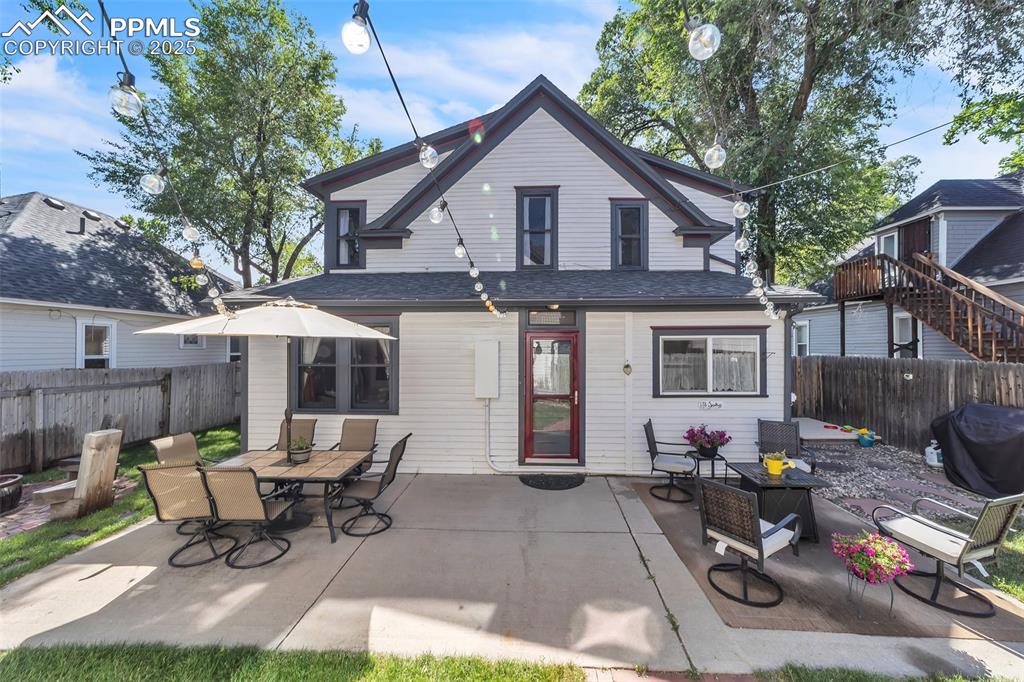 Image 39 of 49: Back of house featuring a patio area and a fenced backyard