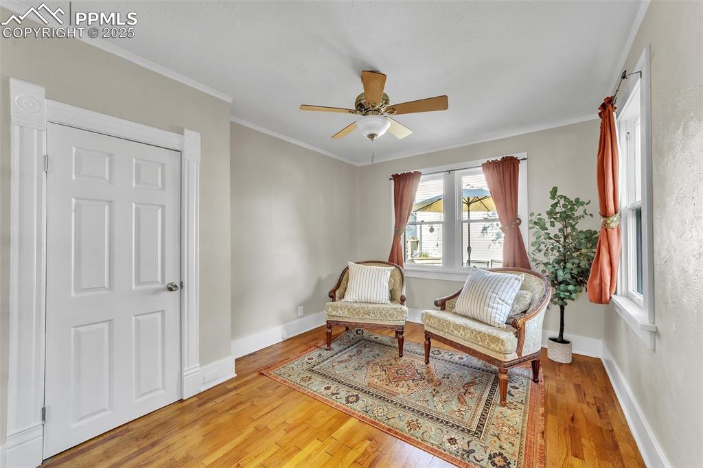 Image 6 of 49: Bedroom or Office on main level with french doors and a closet