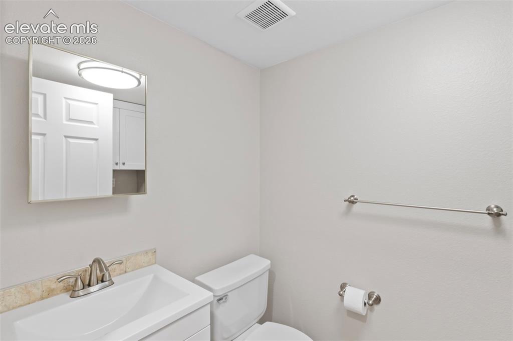 Image 15 of 30: Conveniently located main-level powder room