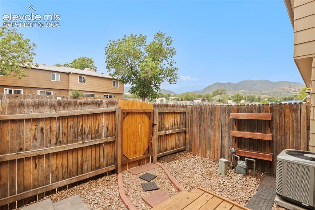 Image 25 of 30: Enjoy your morning coffee with gorgeous mountain views from the newer wood