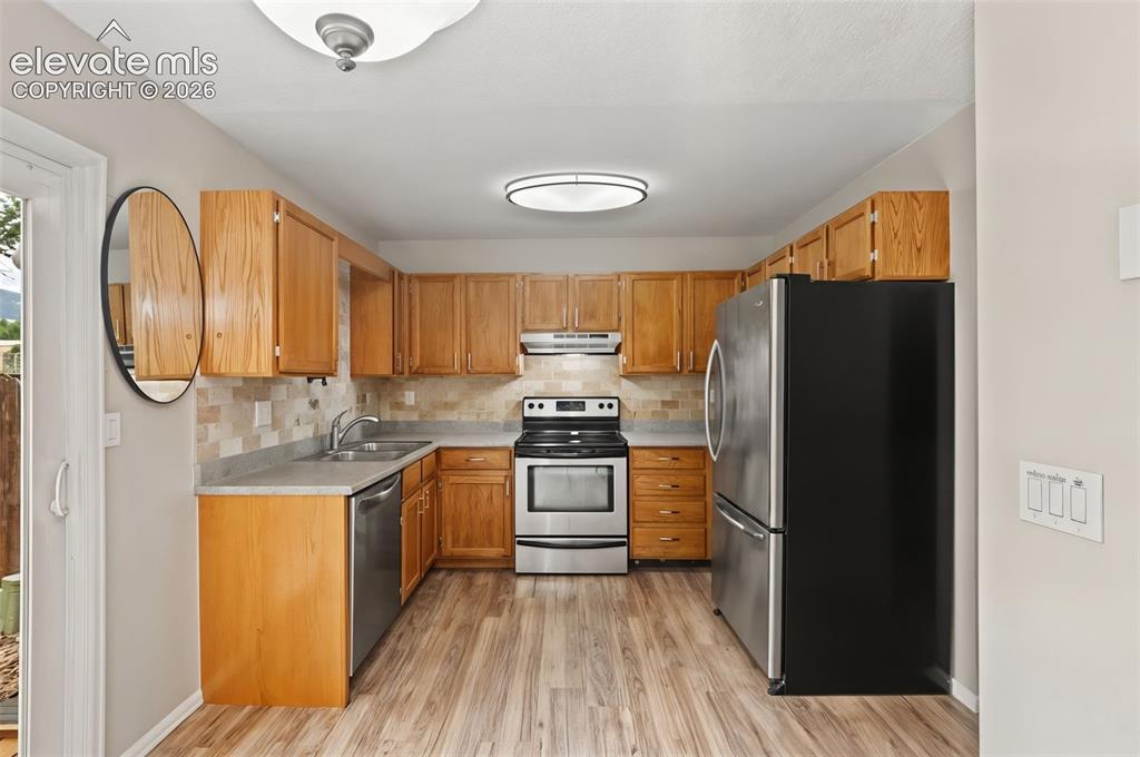 Image 9 of 30: The kitchen features a brand-new dishwasher