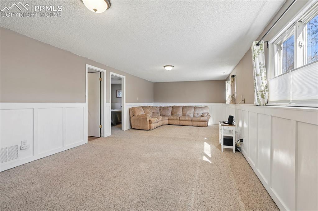 Image 18 of 41: Lower Level Family Room Area