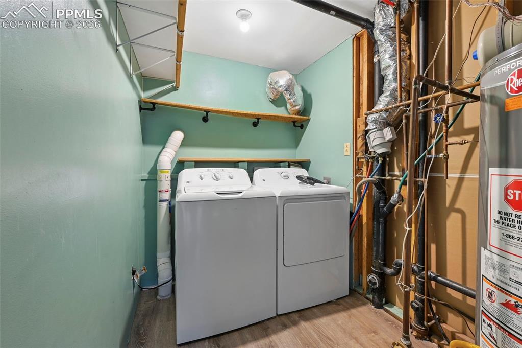 Image 24 of 41: Laundry room and utilities on the lower level