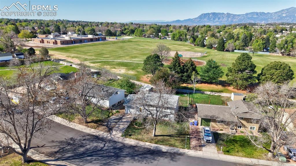 Image 32 of 41: Aerial view of the home with open space behind