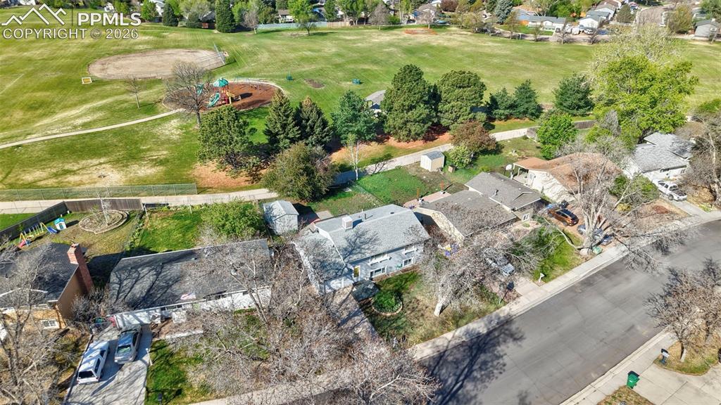Image 34 of 41: Aerial View of home and open space behind